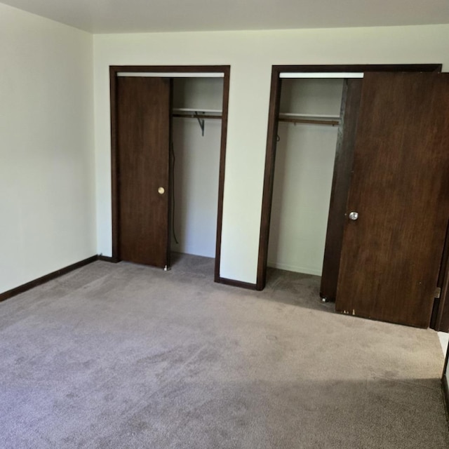 1041 N NW Hwy Unit A4, Park Ridge, IL 60068 - unfurnished bedroom with two closets and light carpet