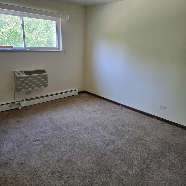 1041 N NW Hwy Unit A4, Park Ridge, IL 60068 - spare room featuring an AC wall unit, carpet flooring, and a baseboard radiator
