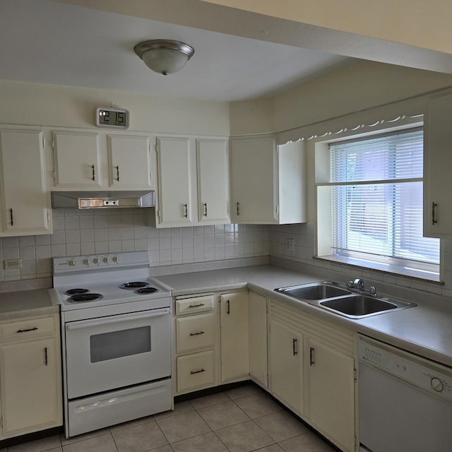 1041 N NW Hwy Unit A4, Park Ridge, IL 60068 - kitchen with white appliances, under cabinet range hood, tasteful backsplash, light countertops, and light tile patterned floors
