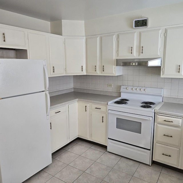 1041 N NW Hwy Unit A4, Park Ridge, IL 60068 - kitchen featuring white appliances, under cabinet range hood, light countertops, and tasteful backsplash