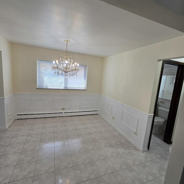 1041 N NW Hwy Unit A4, Park Ridge, IL 60068 - unfurnished dining area featuring a decorative wall, a wainscoted wall, a baseboard heating unit, a chandelier, and light tile patterned floors