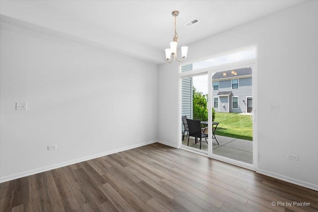 23540 W Bancroft Dr Unit 0, Plainfield, IL 60585 - empty room with a chandelier and wood finished floors