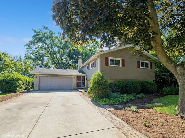 235 S Cedar St, Palatine, IL 60067 - split level home with brick siding, driveway, a chimney, and an attached garage