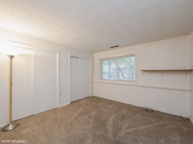 235 S Cedar St, Palatine, IL 60067 - unfurnished bedroom featuring carpet flooring and two closets