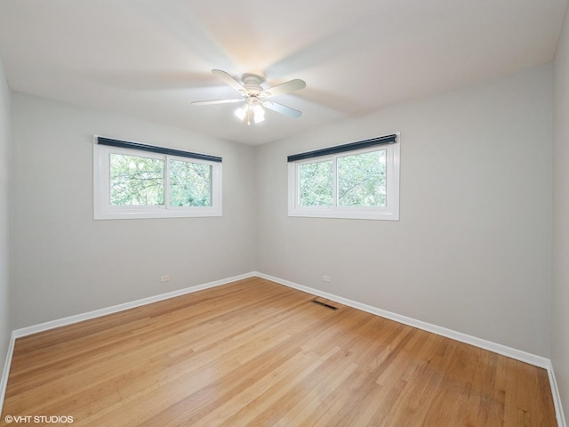 235 S Cedar St, Palatine, IL 60067 - empty room with light wood finished floors and a ceiling fan