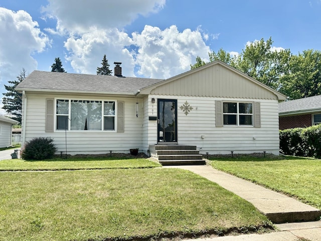 505 Highland St, Belvidere, IL 61008 - ranch-style home with a front yard, a chimney, and roof with shingles