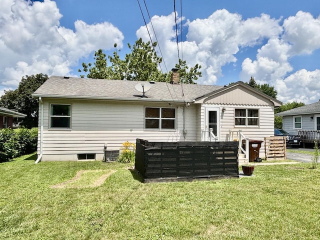 505 Highland St, Belvidere, IL 61008 - back of property with a lawn, a chimney, and roof with shingles