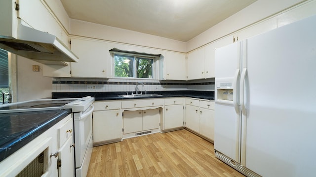 4209 Rotary Rd, Rockford, IL 61109 - kitchen with white appliances, under cabinet range hood, light wood-style flooring, and decorative backsplash