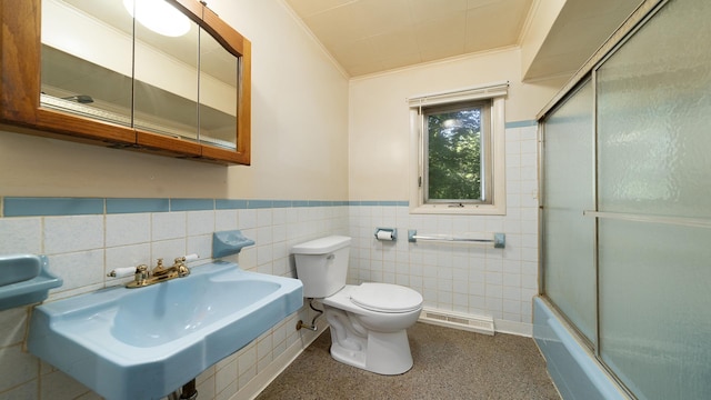 4209 Rotary Rd, Rockford, IL 61109 - full bath featuring crown molding, a wainscoted wall, enclosed tub / shower combo, tile walls, and speckled floor