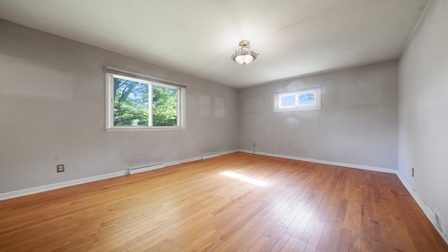 4209 Rotary Rd, Rockford, IL 61109 - spare room featuring a baseboard radiator and hardwood / wood-style flooring