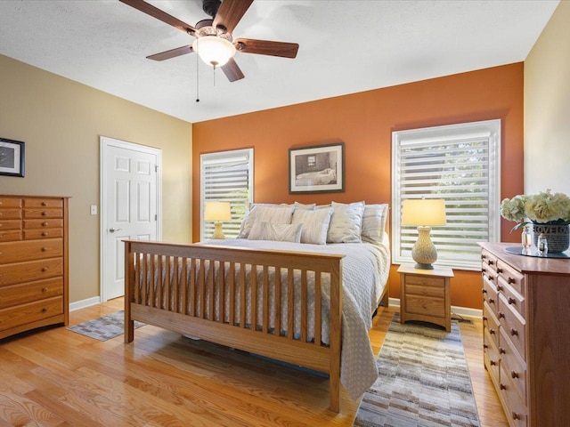 7681 Highlands Dr, Rockford, IL 61102 - bedroom with light wood-style floors and ceiling fan