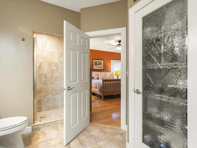 7681 Highlands Dr, Rockford, IL 61102 - full bathroom with ceiling fan, a stall shower, connected bathroom, and tile patterned floors