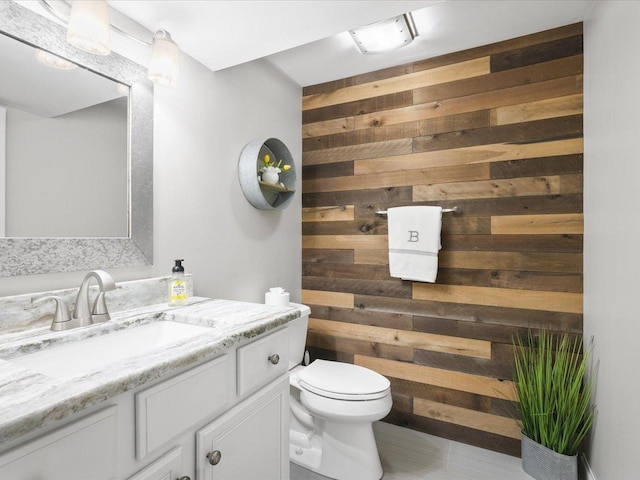 7681 Highlands Dr, Rockford, IL 61102 - bathroom featuring wooden walls and vanity