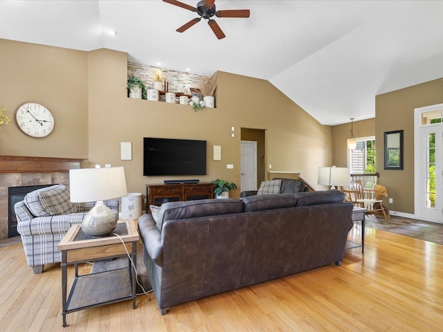 7681 Highlands Dr, Rockford, IL 61102 - living area featuring ceiling fan, wood finished floors, high vaulted ceiling, a fireplace, and recessed lighting