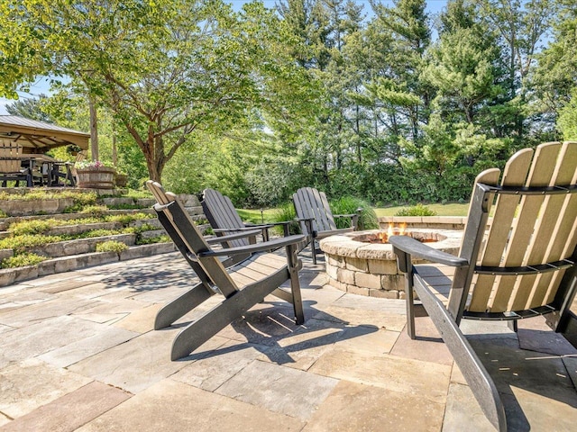 7681 Highlands Dr, Rockford, IL 61102 - view of patio featuring an outdoor fire pit