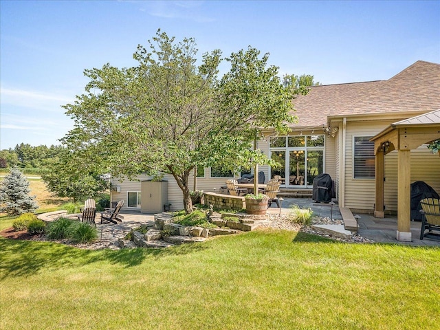 7681 Highlands Dr, Rockford, IL 61102 - view of green lawn with a patio