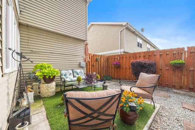 2626 E Martha Pl, Burnham, IL 60633 - fenced backyard with an outdoor living space and a patio area