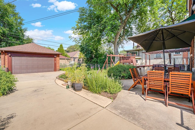 9146 S Hamilton Ave, Chicago, IL 60643 - view of patio with a detached garage, a playground, an outdoor structure, and outdoor dining area