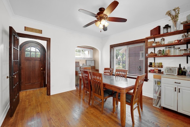 9146 S Hamilton Ave, Chicago, IL 60643 - dining area with arched walkways, light wood finished floors, healthy amount of natural light, and crown molding