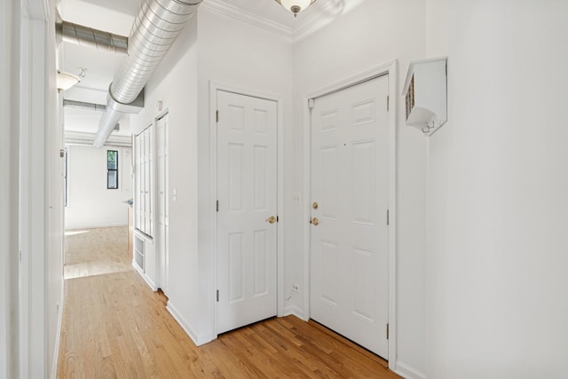 1023 W Balmoral Ave Unit 3A, Chicago, IL 60640 - corridor with light wood-style flooring and crown molding