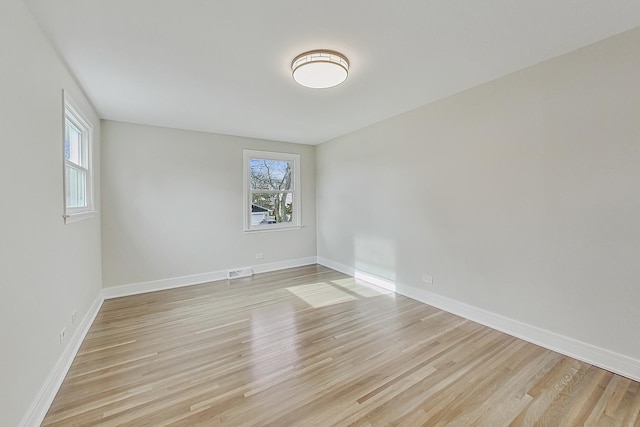 2024 E Wintergreen Ave, Mount Prospect, IL 60056 - empty room featuring plenty of natural light and light wood-style flooring