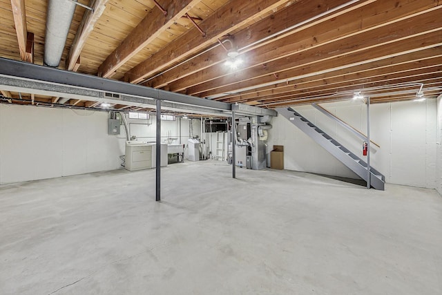 2024 E Wintergreen Ave, Mount Prospect, IL 60056 - unfinished basement with washing machine and clothes dryer, stairs, and electric panel