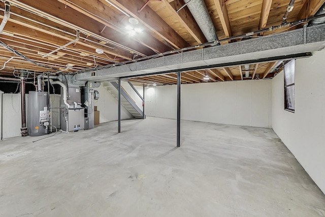 2024 E Wintergreen Ave, Mount Prospect, IL 60056 - unfinished basement featuring gas water heater, stairway, and heating unit
