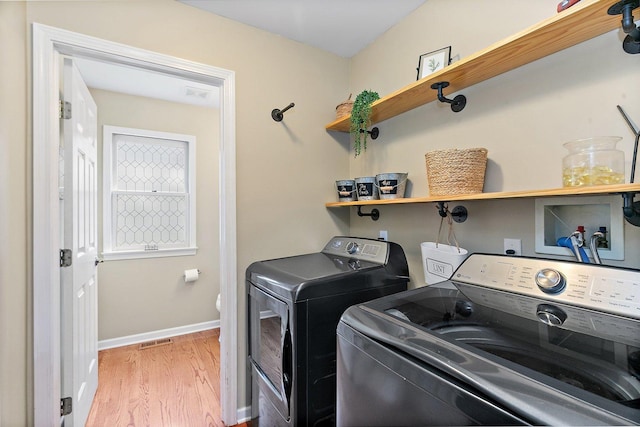 105 Devonshire Dr, Dekalb, IL 60115 - laundry room with washer and dryer and light wood-style floors