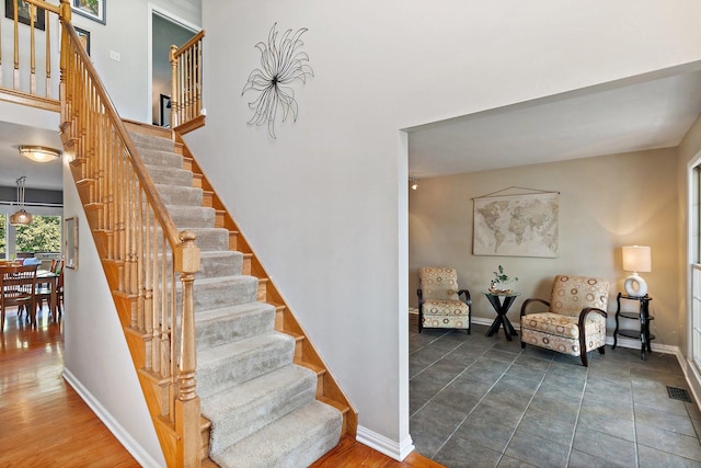 105 Devonshire Dr, Dekalb, IL 60115 - stairway featuring baseboards