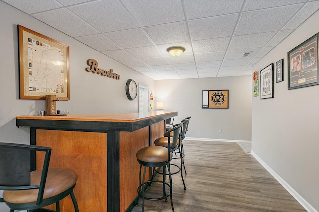 105 Devonshire Dr, Dekalb, IL 60115 - indoor dry bar with a drop ceiling and wood finished floors