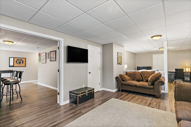 105 Devonshire Dr, Dekalb, IL 60115 - living room featuring a paneled ceiling and dark wood-style flooring