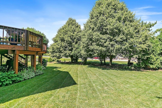 105 Devonshire Dr, Dekalb, IL 60115 - view of grassy yard with a wooden deck and stairway