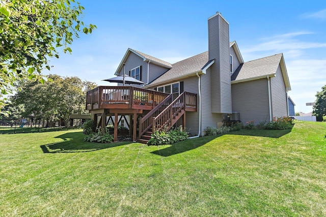 105 Devonshire Dr, Dekalb, IL 60115 - rear view of property with a deck, a yard, a chimney, stairway, and a shingled roof