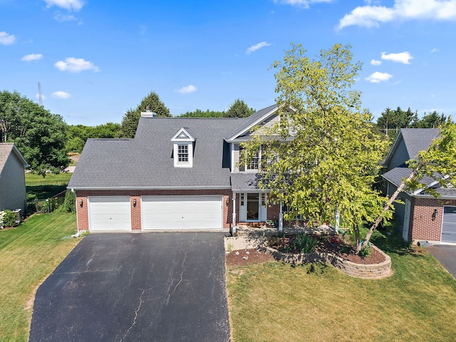 105 Devonshire Dr, Dekalb, IL 60115 - traditional home featuring driveway, brick siding, a front lawn, and a garage