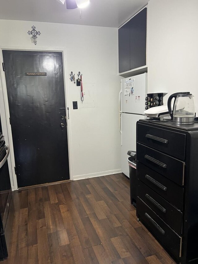 8710 Skokie Blvd Unit 1A, Skokie, IL 60077 - kitchen with ceiling fan, dark wood-type flooring, dark cabinets, and freestanding refrigerator