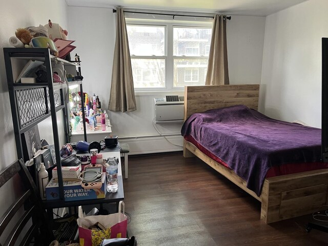 8710 Skokie Blvd Unit 1A, Skokie, IL 60077 - bedroom with baseboard heating, wood finished floors, and a wall mounted AC