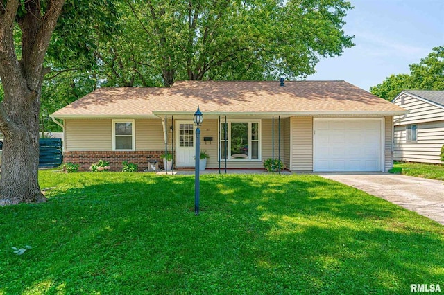 145 White Ave, Lincoln, IL 62656 - single story home with driveway, a garage, a front yard, a porch, and brick siding