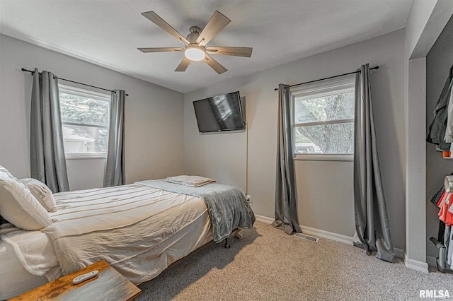 145 White Ave, Lincoln, IL 62656 - bedroom with light colored carpet and a ceiling fan