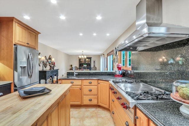 330 Dorchester Ln, Grayslake, IL 60030 - kitchen featuring stainless steel appliances, wall chimney range hood, wooden counters, a chandelier, and backsplash