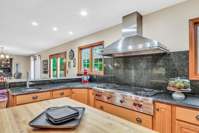 330 Dorchester Ln, Grayslake, IL 60030 - kitchen featuring wall chimney range hood, stainless steel gas stovetop, backsplash, recessed lighting, and dark stone countertops