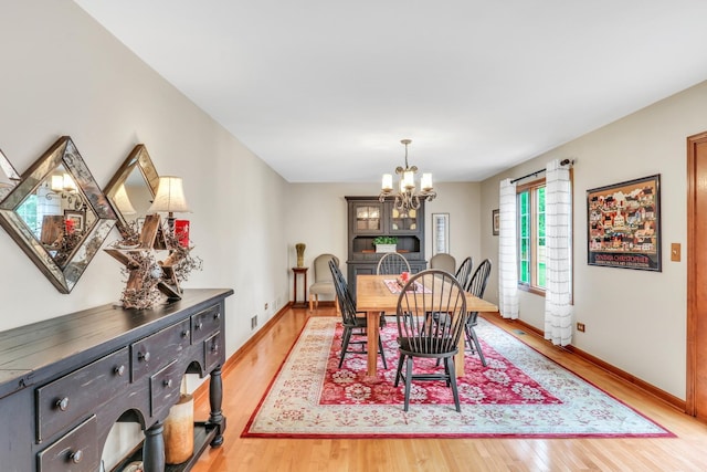 330 Dorchester Ln, Grayslake, IL 60030 - dining area with a chandelier and light wood-style floors