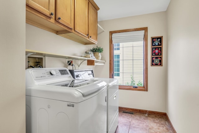 330 Dorchester Ln, Grayslake, IL 60030 - laundry room with washing machine and dryer, cabinet space, and light tile patterned floors