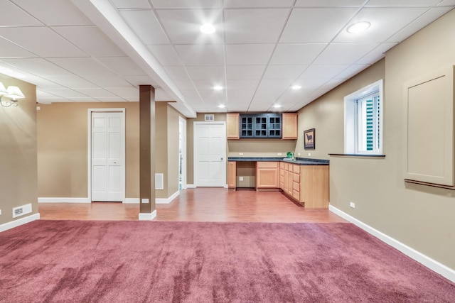 330 Dorchester Ln, Grayslake, IL 60030 - kitchen with carpet, dark countertops, light brown cabinets, glass insert cabinets, and a paneled ceiling