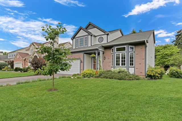 330 Dorchester Ln, Grayslake, IL 60030 - view of front of home featuring a front lawn, brick siding, and concrete driveway