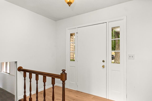 1219 Nicki Dr, Bloomington, IL 61704 - foyer featuring light wood-style flooring and baseboards