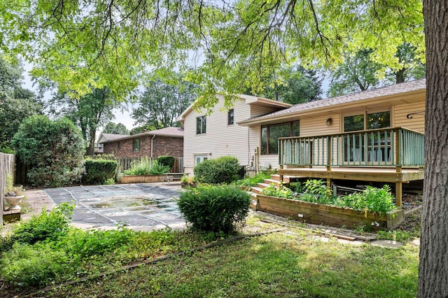1219 Nicki Dr, Bloomington, IL 61704 - back of house featuring a patio area and a deck