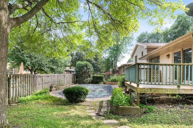 1219 Nicki Dr, Bloomington, IL 61704 - fenced backyard featuring a wooden deck and a patio area