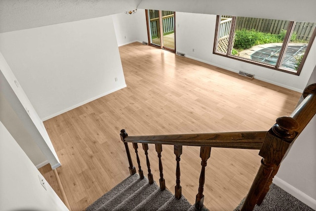 1219 Nicki Dr, Bloomington, IL 61704 - stairs with wood finished floors and a chandelier