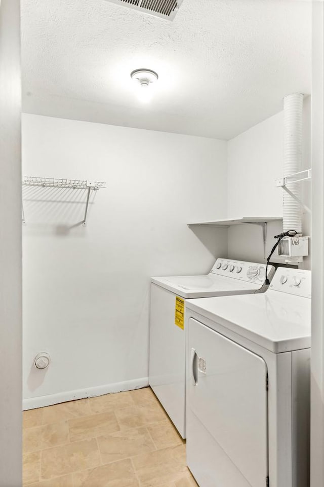 1219 Nicki Dr, Bloomington, IL 61704 - washroom with separate washer and dryer and a textured ceiling