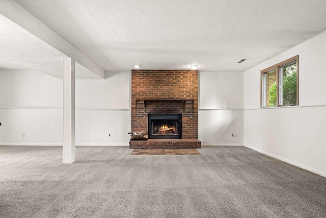 1219 Nicki Dr, Bloomington, IL 61704 - unfurnished living room featuring a textured ceiling, carpet, and a brick fireplace
